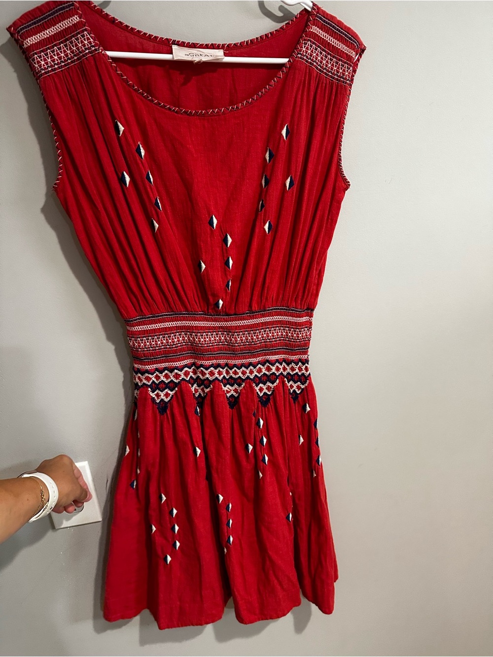 THE GREAT Red Sleeveless Embroidered Smocked Waist-Detail Dress